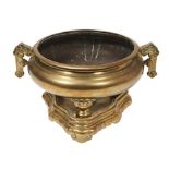 LARGE GILT-BRONZE TRIPOD CENSER AND STAND QING DYNASTY of compressed baluster form, with twin