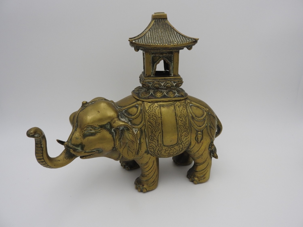 GILT-BRONZE CAPARISONED ELEPHANT CENSER LATE QING DYNASTY the beast shown with head turned slightly 