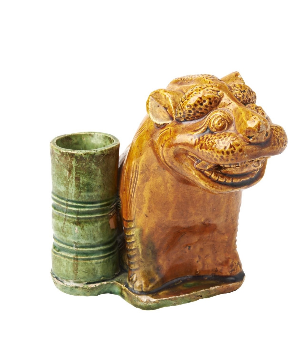 SANCAI GLAZE FIGURE OF A LION MING OR LATER modelled seated beside a bamboo stork&nbsp; 12.5cm high 