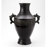 ARCHAISTIC BRONZE VASE QING DYNASTY, 19TH CENTURY the baluster sides decorated in relief with a band