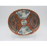 JAPANESE IMARI ENAMELLED OVAL DISH MEIJI PERIOD painted with panels of flowers and birds 28cm wide