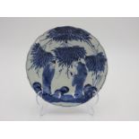 JAPANESE KO IMARI BLUE AND WHITE ROBED DISH 18TH CENTURY depicting two wisemen amongst trees and