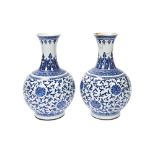 LARGE PAIR OF BLUE AND WHITE 'LOTUS' VASES QING DYNASTY, 19TH CENTURY painted in tones of underglaze