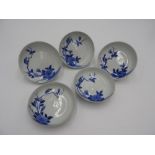 FIVE NABESHIMA BLUE AND WHITE DISHES 18TH/19TH CENTURY depicting flower blooming and a sparrow on