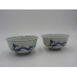 PAIR OF JAPANESE IMARI BLUE AND WHITE BOWLS EDO PERIOD, 18TH CENTURY painted with dragons to