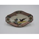 KO KUTANI ENAMELLED DISH 17TH CENTURY painted with a pheasant beside flowering stems 18.5cm wide