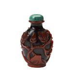 PEKING GLASS RED OVERLAY SNUFF BOTTLE QING DYNASTY, 19TH CENTURY crvade through a layer of red