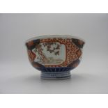 JAPANESE IMARI BOWL 18TH / 19TH CENTURY the sides painted with panels of blossoming prunus,