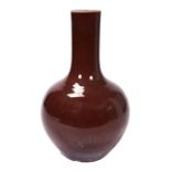 LARGE FLAMBE BOTTLE VASE QING DYNASTY the thick raspberry red glaze thinning around the rim 59cm