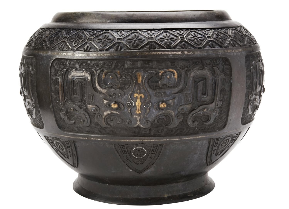 LARGE ARCHAISTIC BRONZE JARDINIERE QING DYNASTY, 19TH CENTURY the baluster sides decorated in relief