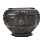 LARGE ARCHAISTIC BRONZE JARDINIERE QING DYNASTY, 19TH CENTURY the baluster sides decorated in relief