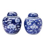 TWO 'CRACKED-ICE AND PRUNUS' BLUE AND WHITE GINGER JARS AND COVERS KANGXI FOUR CHARACTER MARKS BUT