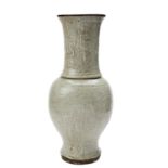 CELADON-GLAZED BALUSTER VASE MING DYNASTY the sides with incised foliate decoration 43cm high