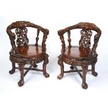 IMPRESSIVE PAIR OF CARVED HONGMU 'DRAGON' ARMCHAIRS QING DYNASTY, 19TH CENTURY the curved arms