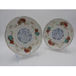 PAIR OF IMARI ENAMELLED DISHES LATE EDO PERIOD painted with eight horses and a central lion