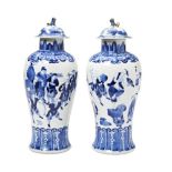 PAIR OF BLUE AND WHITE BALUSTER VASES AND COVERS QING DYNASTY, 19TH CENTURY the sides painted in