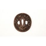 JAPANESE IRON AND GILT DECORATED TSUBA EDO PERIOD of openwork form decorated with a phoenix in