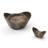 TWO CHINESE SILVER INGOTS of boats shape form, with impressed seal marks 6.5cm and 3cm wide