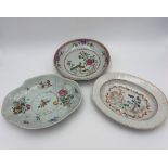 THREE FAMILLE ROSE DISHES QING DYNASTY, 18TH CENTURY one of oval form painted with a village