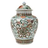 TRANSITIONAL WUCAI JAR AND COVER 17TH CENTURY the body painted with four lions amidst ribbons,