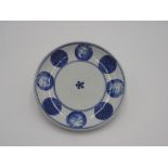 JAPANESE IMARI BLUE AND WHITE PLATE 17TH CENTURY painted in underglaze blue with a floral design