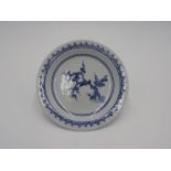 JAPANESE BLUE AND WHITE DISH 17TH CENTURY painted with a plum tree 14.5cm diam