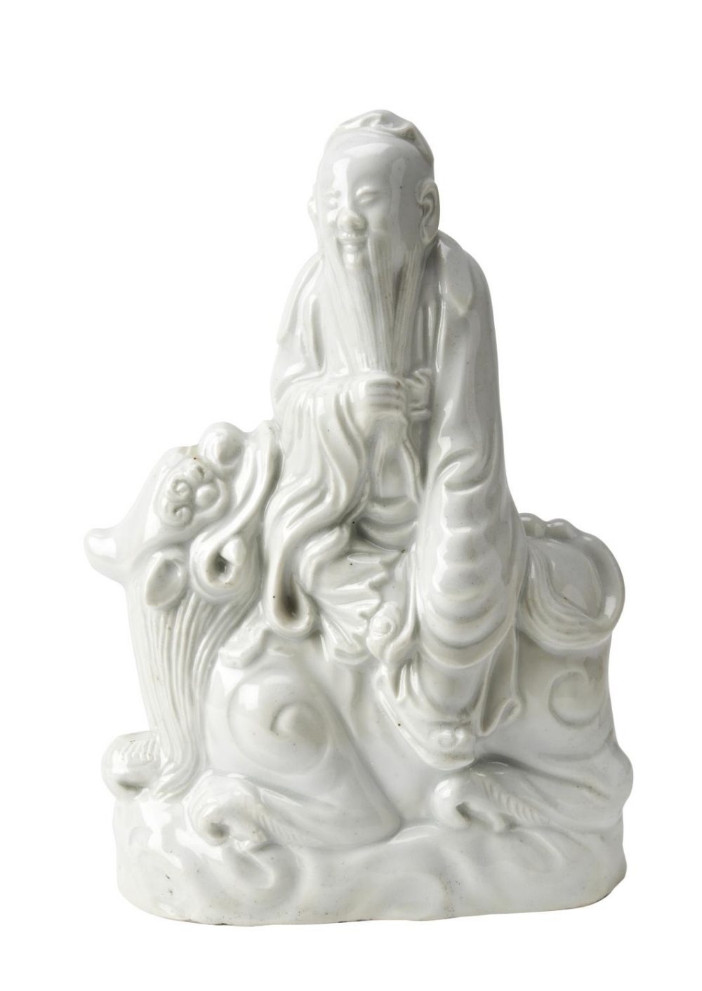 BLANC DE CHINE GROUP QING DYNASTY modelled as Shoulao astride a Buddhist lion 19cm high  PROVENANCE: