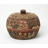 CARVED POLYCHROME PAINTED CIRCULAR BOX AND COVER INDONESIAN, 19TH / 20TH CENTURY the sides carved