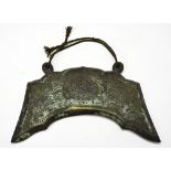 ARCHAISTIC BRONZE GONG 20TH CENTURY in the form of an axe head 22cm wide PROVENANCE: Prominent