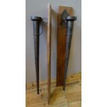 A PAIR OF LARGE WALL MOUNTED TAPERED CYLINDRICAL METAL CANDLE HOLDERS, with serpentine brackets