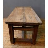 A SOLID PINE PLANK TOP WORK BENCH / RUSTIC TABLE ON WIDE SQUARE LEGS, WITH DUAL LEVEL STRETCHER BARS