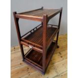 3-TIER ARTS AND CRAFTS TEAK WOOD SLATTED TROLLEY with makers label bearing the name Hughes,