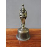 INDIAN BRASS BELL 19TH CENTURY 25cm high; together with a SMALLER EXAMPLE, 13cm high (2)