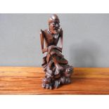 HARDWOOD FIGURE OF MARKET TRADER (20cm high)