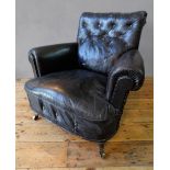VINTAGE DISTRESSED BLACK LEATHER BUTTON BACK TUB CHAIR ON TURNED FRONT LEGS AND CASTORS (92cm
