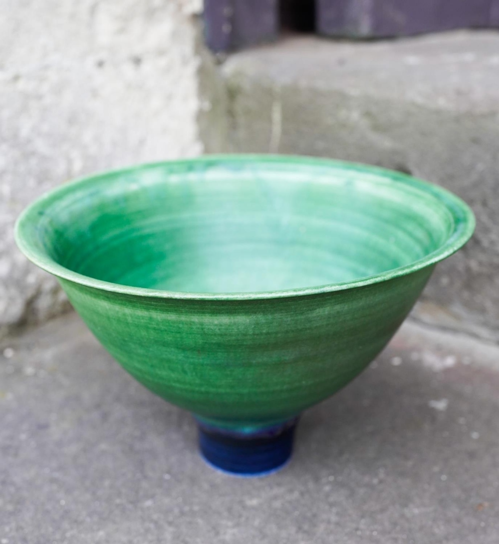 MARY RICH (b.1940) FOOTED BOWL covered in a rich green-glaze, impressed mark 17.5cm diam 