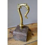 MOUNTED BRASS CROSIER (STAFF) 18TH CENTURY mounted an square oak base 25cm high (including base)