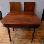 GEORGIAN MAHOGANY D-END DINING TABLE WITH TWO LEAVES, on turned tapered legs terminating in brass