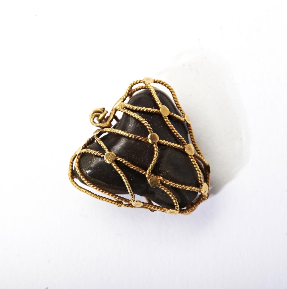 GOLD ENCASED BEZOARS STONE PENDANT the bezoars stone encased in twisted gold cage 