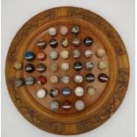 A LARGE SOLITAIRE BOARD with specimen mineral spheres, each individually hand labelled. Modern. 36