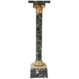 A 19TH CENTURY SERPENTINE COLUMN the square top over an architectural bronze embellished capital,