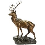 AFTER JULES EDMOND MASSON GRAND CERF SUR UN ROCHER a patinated bronze stag upon a naturalistic