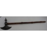 A CONTINENTAL STEEL BATTLE AXE LATE 18TH/19TH CENTURY with blade opposed by a spike and mounted on a