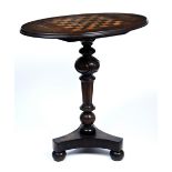 A 19TH CENTURY GAMES TABLE the oval top with chess board inlay and two shell patera, the column upon