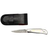 A FINE GEOFF HAGUE FOLDING POCKET KNIFE the steel handle inset with mother of pearl, with Damascus