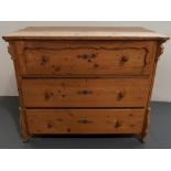 A CONTINENTAL PINE CHEST OF DRAWERS the top drawer with shaped panel, with canted corners and shaped