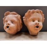 TWO CONTEMPORARY TERRACOTTA PUTTI WALL FOUNTS  18cm x 20cm