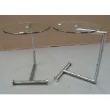 A PAIR OF EILEEN GRAY STYLE MODERN CHROME AND GLASS SIDE TABLES. 62 x 46 cms.