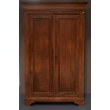 A 19TH CENTURY FRENCH STRIPPED PINE ARMOIRE WITH PLAIN PANELLED DOORS the interior refitted with