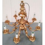 A BRASS DUTCH STYLE 8 BRANCH CHANDELIER (modern) 72 cm high, 80 cm diam